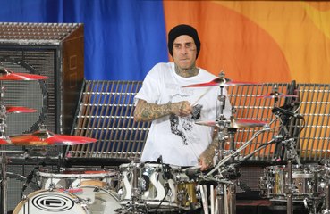 Travis Barker credits the "power of love" for getting him back on a plane