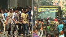 Protesters throw stones and vandalise buses as workers rally in Bangladesh for better wages