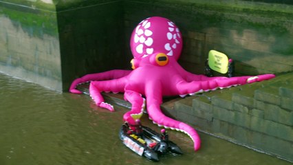 Greenpeace activists unfurl a giant octopus in the Thames