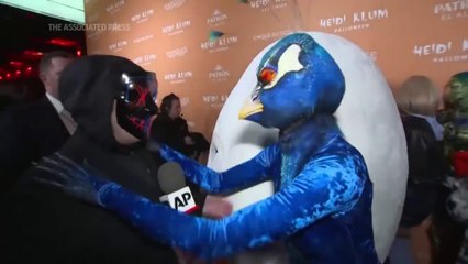 Heidi Klum arrives at her annual Halloween party dressed as a peacock