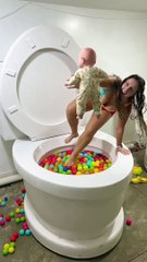 SAVING The BABY and Doing Fun HANDSTAND TRICK in Giant Toilet Play Ball Pool