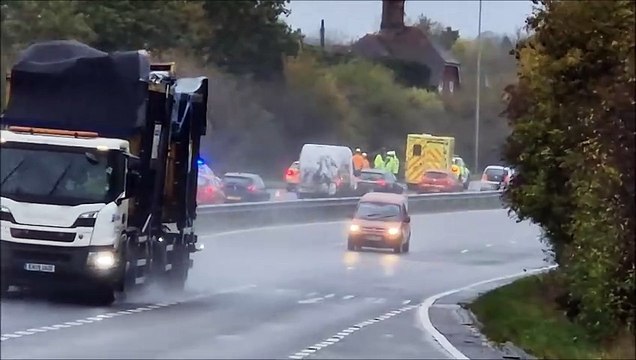 Emergency services respond to a car on it's roof on the north bound carraigeway of the A23 at Hickstead