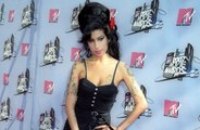 Amy Winehouse's dad Mitch is suing two of the late singer's friends