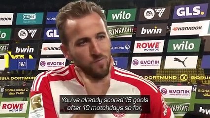 Kane reacts to breaking a Bundesliga scoring record