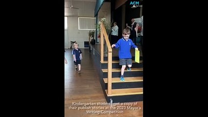 WATCH: Kindergarten students get a copy of their first published stories at the 2023 Mayor's Writing Competition. Video supplied
