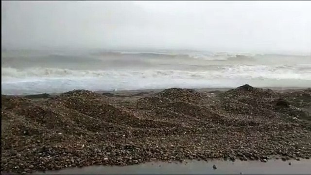 Worthing Pier at high tide in a hailstorm November 4 2023