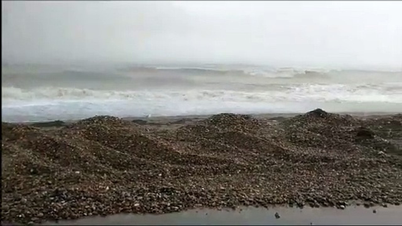 Worthing Pier at high tide in a hailstorm November 4 2023