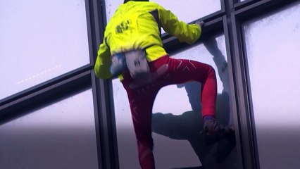 'French Spider-Man' scales TotalEnergies skyscraper for peace in the Middle East
