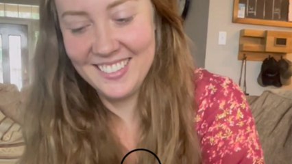 Lively woman can't control her laughter as she calls other people and acts like they called her