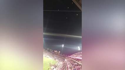 Mysterious glowing objects float in sky above football game in California