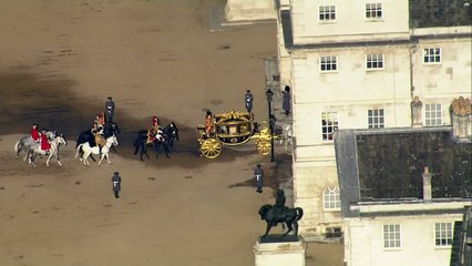 King arrives in Westminster for State Opening of Parliament