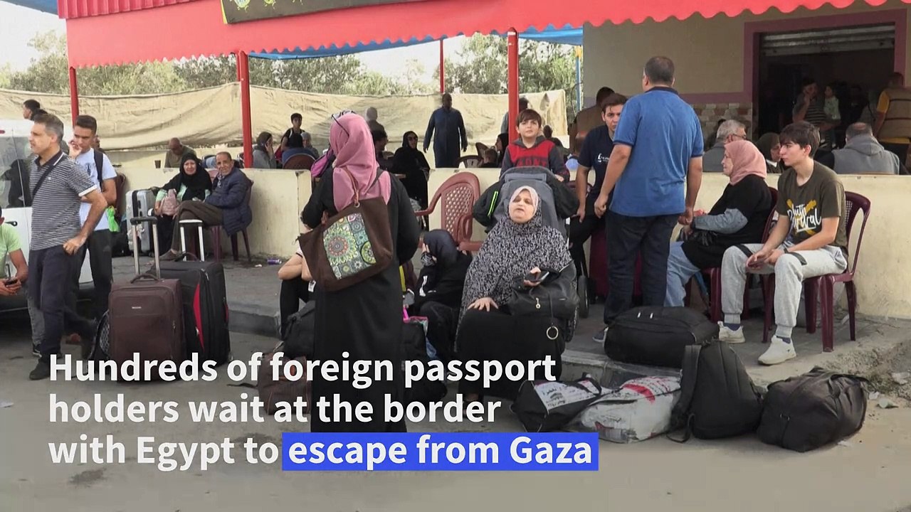Foreign passport holders wait at Rafah border for evacuation to Egypt