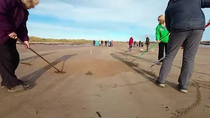 Huge 90ft Remembrance Day poppy carved onto beach