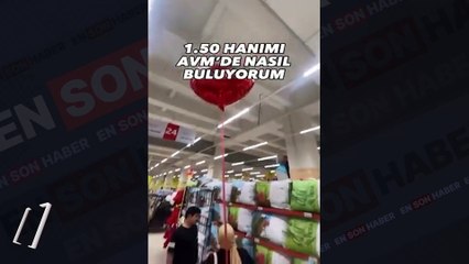 Kısa boylu eşini markette bulabilmek çantasına balon bağladı