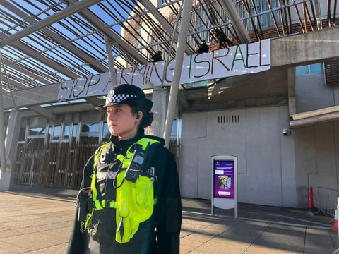 Protesters against the war in Gaza on the roof of the Scottish Parliament