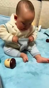 Baby got angry while wearing socks