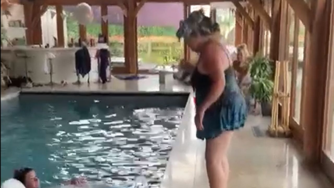 Woman trying to enter pool without getting hair wet experiences the most HILARIOUS fail moment