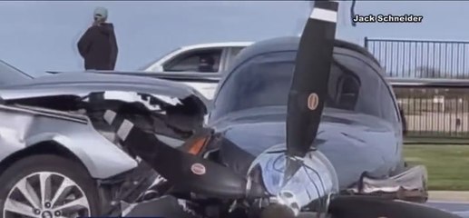 Watch: Plane smashes through fence and crashes into car