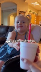 Hilarious Food Tug-of-War: Daughter's Grumpy Reaction to Sharing with Mom!
