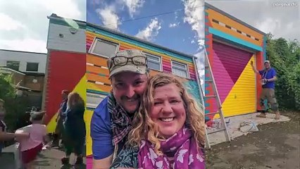 Artist who transforms streets by painting houses different colours has brought her 'rainbow' touch to a school