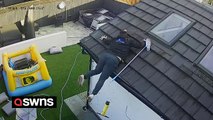 Hilarious footage captures moment dad falls off roof while cleaning windows