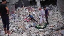 Families dig to retrieve loved ones among thousands of bodies lie buried in rubble in Gaza