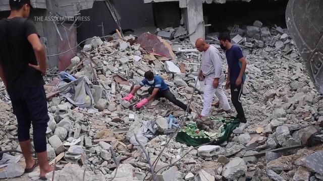 Families dig to retrieve loved ones among thousands of bodies lie buried in rubble in Gaza