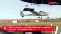 Eğitim uçağı yola yakın iniş yaptığı sırada minibüsü teğet geçti