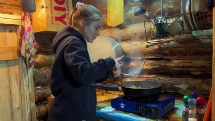 Cozy night with my wife in a wooden house in the cold. Off grid cabin