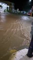 Calles inundadas por las fuertes lluvias en el municipio de Peralta, en Azua