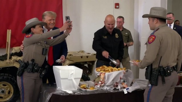Trump takes selfies with law enforcement while serving meals in Texas