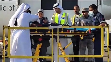 An Emirati official stretched out his ghutra, the traditional headdress, to protect a young patient from sunlight as the toddler was shifted from the flight to the ambulance.