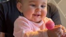 Adorable baby forgets that greed is a curse after she gets her hands on a lollipop