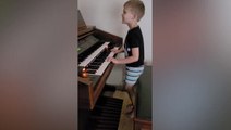 Eight-year-old who lost sight to cancer teaches himself piano