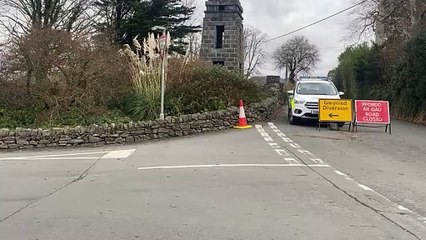 Police have closed a road during the search for four missing teens