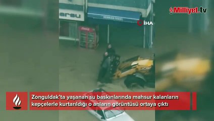 Yaşanan su baskınlarında mahsur kalanların kepçelerle kurtarıldığı o anların görüntüsü ortaya çıktı