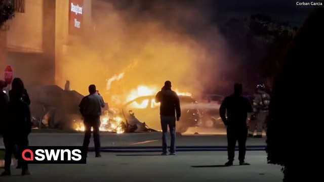Small plane engulfed in flames after it crashed into a Texas shopping centre