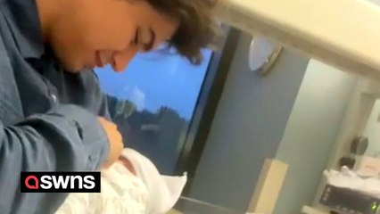 Adorable moment newborn baby copies dad's laugh