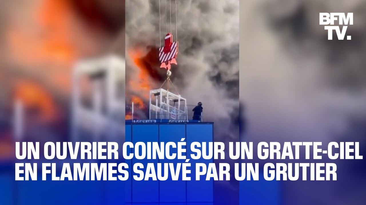 Coincé tout en haut d'un gratte-ciel en flammes en Angleterre, un ouvrier est sauvé par un grutier