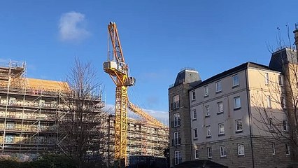 A crane collapsed injuring two people in Leith this morning