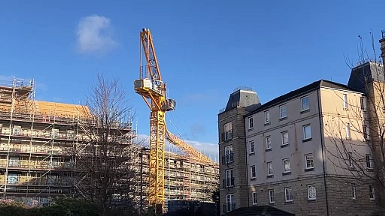 A crane collapsed injuring two people in Leith this morning