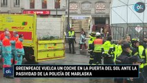 Greenpeace vuelca un coche en la puerta del Sol ante la pasividad de la Policía de Marlaska