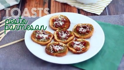 Toasts with pesto, parmesan, and sun-dried tomatoes