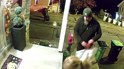 Man Helps Himself To Handfuls Of Candy