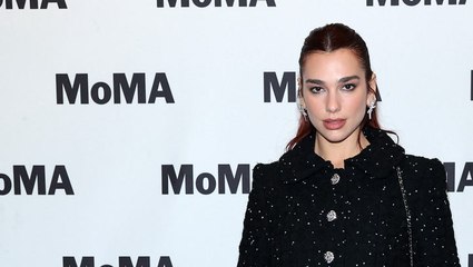 Dua Lipa Rang In the Holiday Season With the Most Festive Coat on the Red Carpet