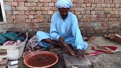 Making of Primitive Leather Shoes by aged Villager Man