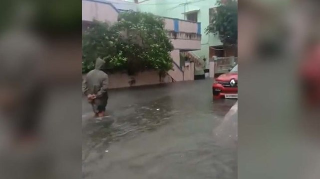 Residents wade through knee-deep water as Chennai hit by flooding