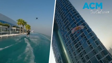 Wakeboarder performs stunt jumping off Dubai infinity pool