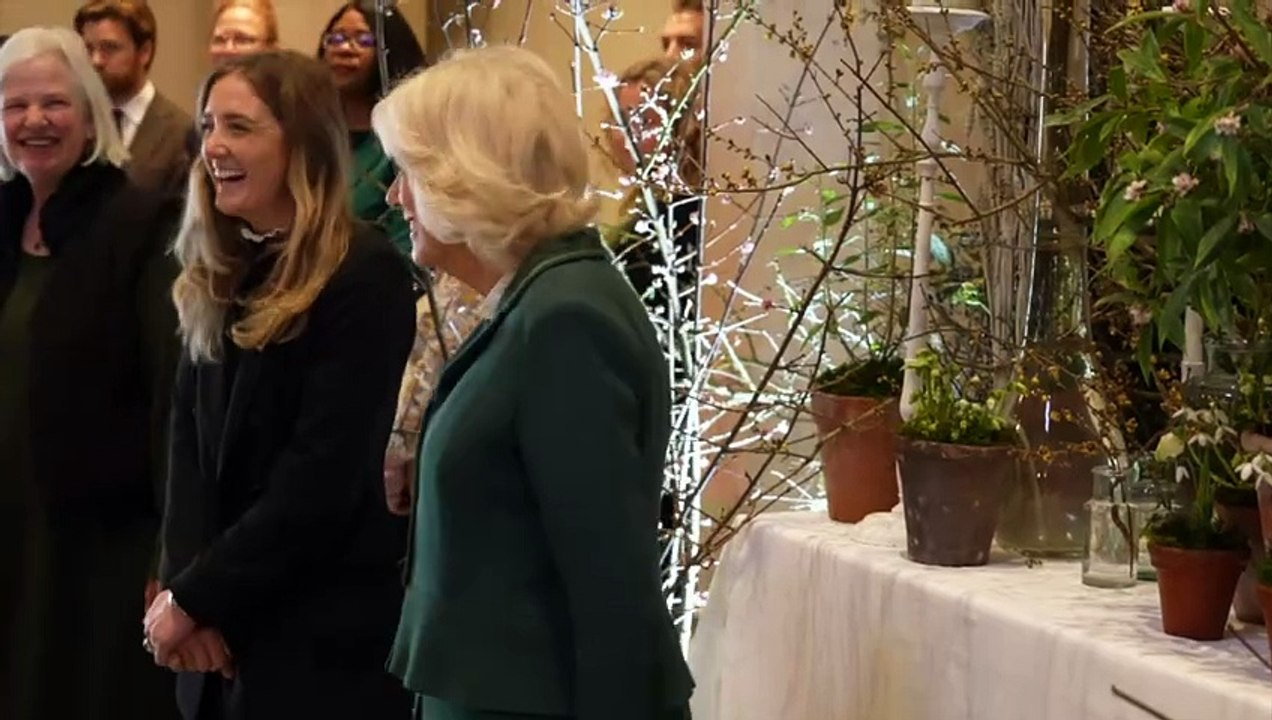 Queen plays dinosaur tug-of-war with little Max during visit