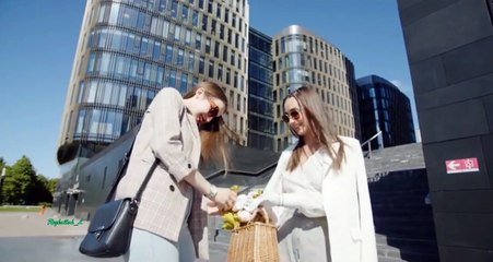 Two young women wander the streets and walk in fashion to Cheb Mami's rai music